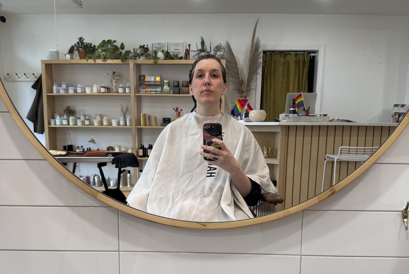 salon mirror selfie where my hair is wet and slicked back before my haircut