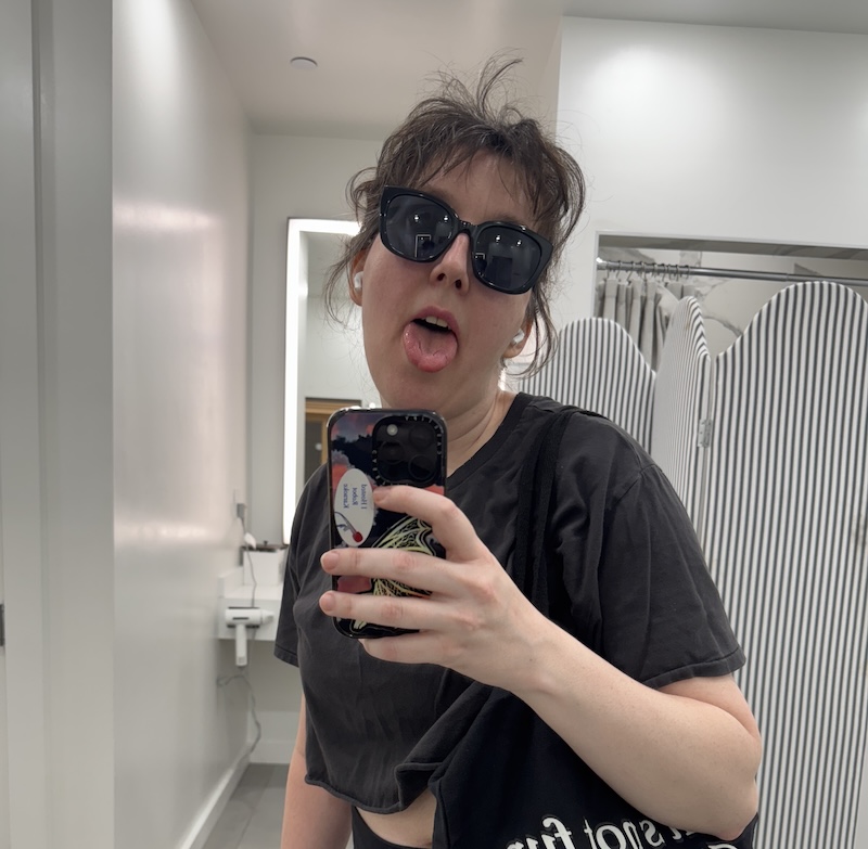 selfie in the gym locker room where i'm sticking my tongue out and my bangs are fighting for their lives