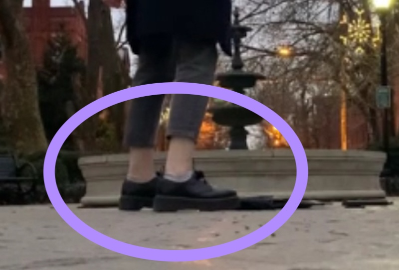 photo of my legs in front of a fountain and my jeans are about 4 inches too short, they look like long capris