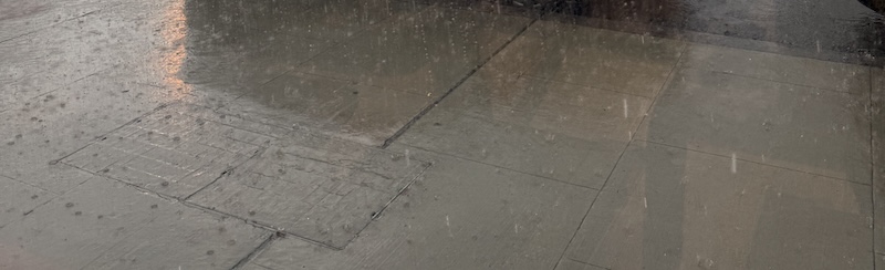 photo of the sidewalk during torrential downpour of rain outside my gym