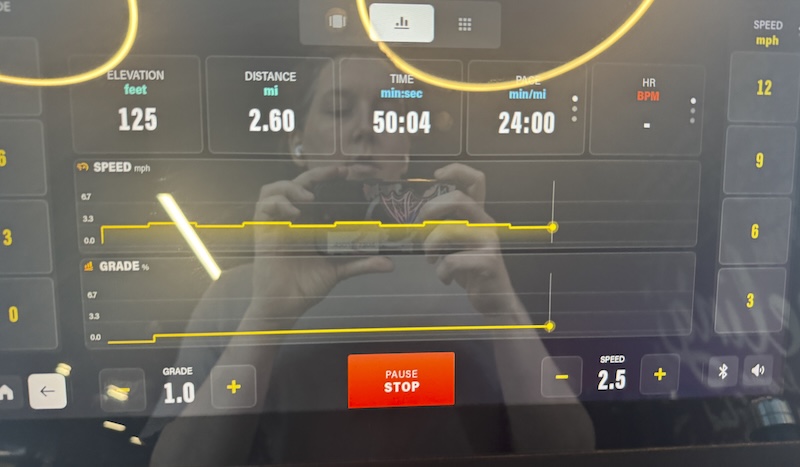 photo of my reflection in the screen of the treadmill at the end of my workout