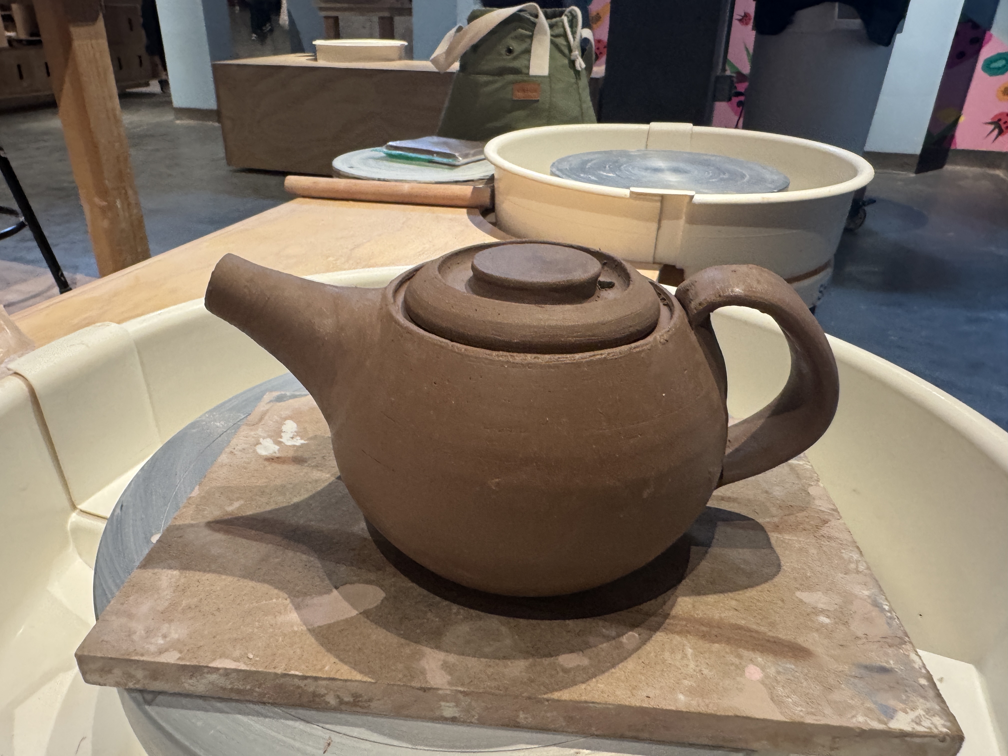 photo of a clay teapot i made and trimmed, and still has some time before it dries fully