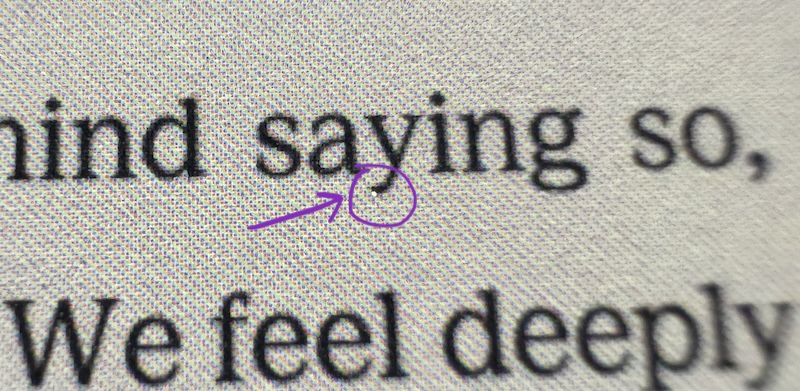 a photo of my new kobo screen and i circled where there is one tiny distracting bright spot
