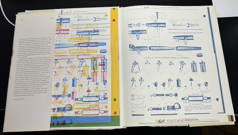 photo of the inside cover of "air powered" which has diagrams of different parts of an airbrush