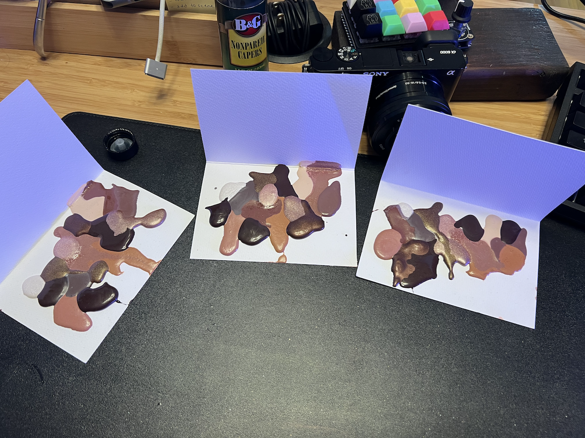 photo of 3 small white watercolor cards where I poured wet watercolor in blobs, turning them into abstract watercolor palettes