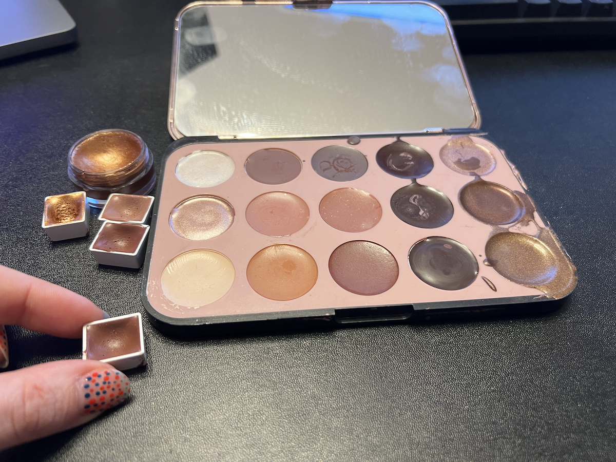 photo of the watercolor palette where the paints have dried/cured fully