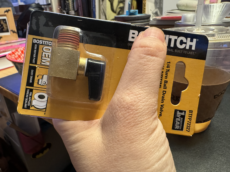 photo of my hand holding the drain valve packaging and using my thumb to cover the brand a little so it says "BITCH" instead of "BOSTITCH"
