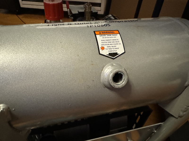 photo of my compressor with the entire drain valve removed