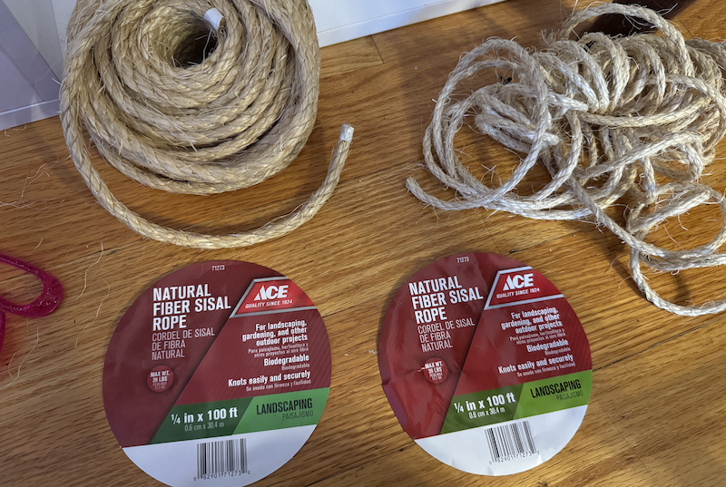 photo of my floor showing two piles of rope and their identical labels in front of them. the rope on the left is about twice as thick as the rope on the right, but the labels say they're both 1/4"