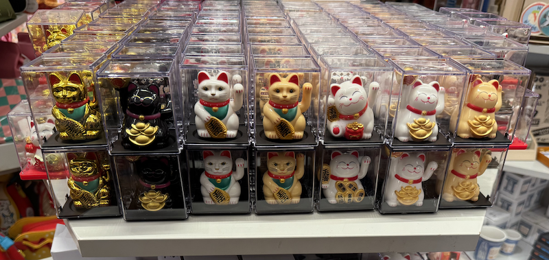 photo of dozens of lucky cat (maneki-neko) figurines inside the chelsea market location of pearl river mart