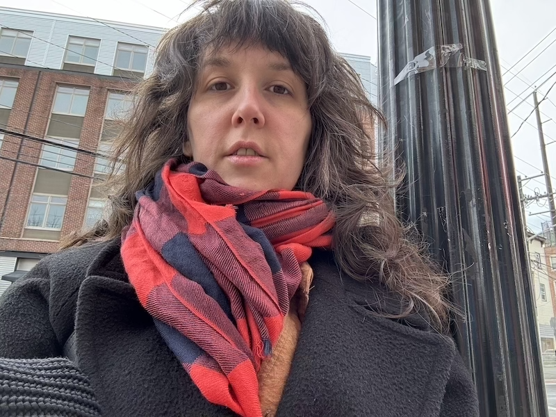 selfie of me outside, bundled up, with my fresh haircut which is just a trim of my usual shag