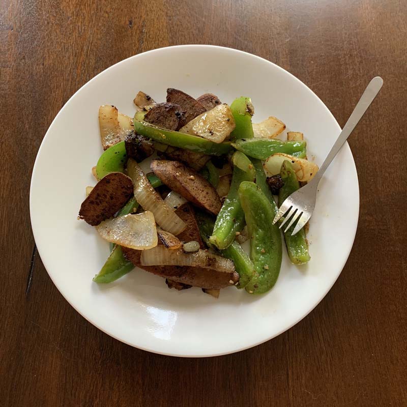 bowl of sausage, peppers and onions