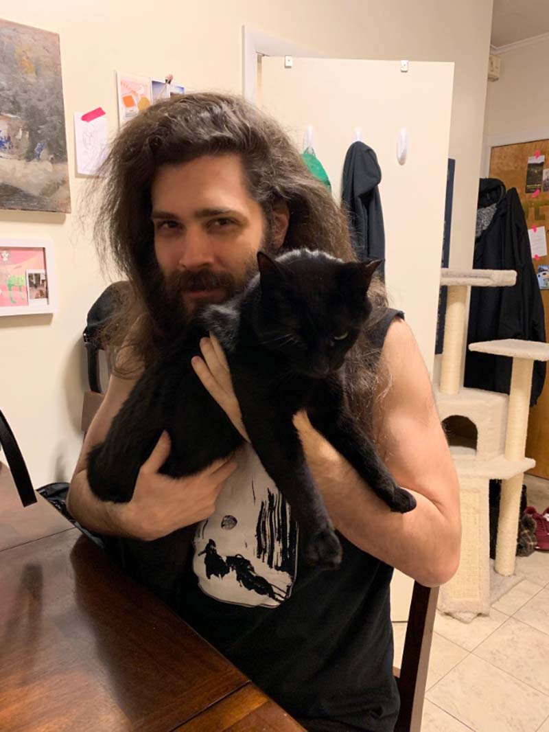 photo of my boyfriend andy holding my black cat pumagreg