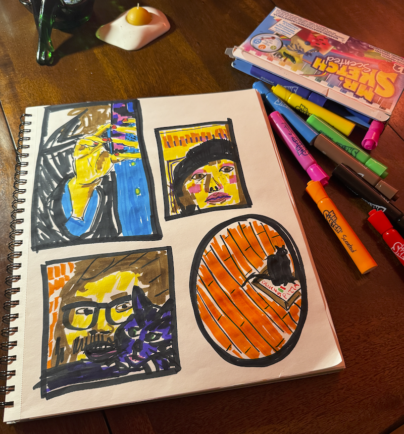 a photo of my sketchbook showing some marker drawings i did of me, andy and puma with my 12 pack of dr. sketch scented markers