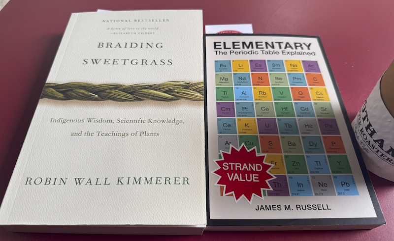 photo of my strand haul: the book braiding sweetgrass by robin wall kimmerer and elementary: the periodic table explained by james m. russell