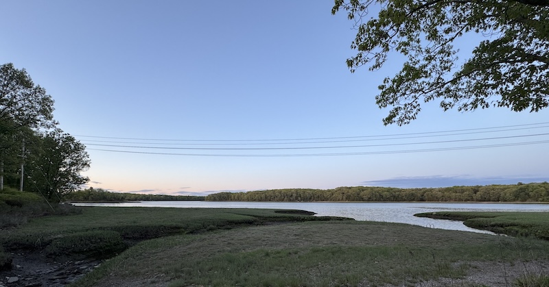 photo of the river alongside great esker park in weymouth, ma. it's very serene and the sun is setting