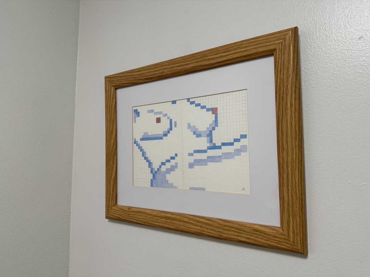 photo of another wall in my bathroom showing a wooden-framed watercolor painting of a nude woman laying back, from neck to thigh, in watercolor, mostly blues and some pink for the nips