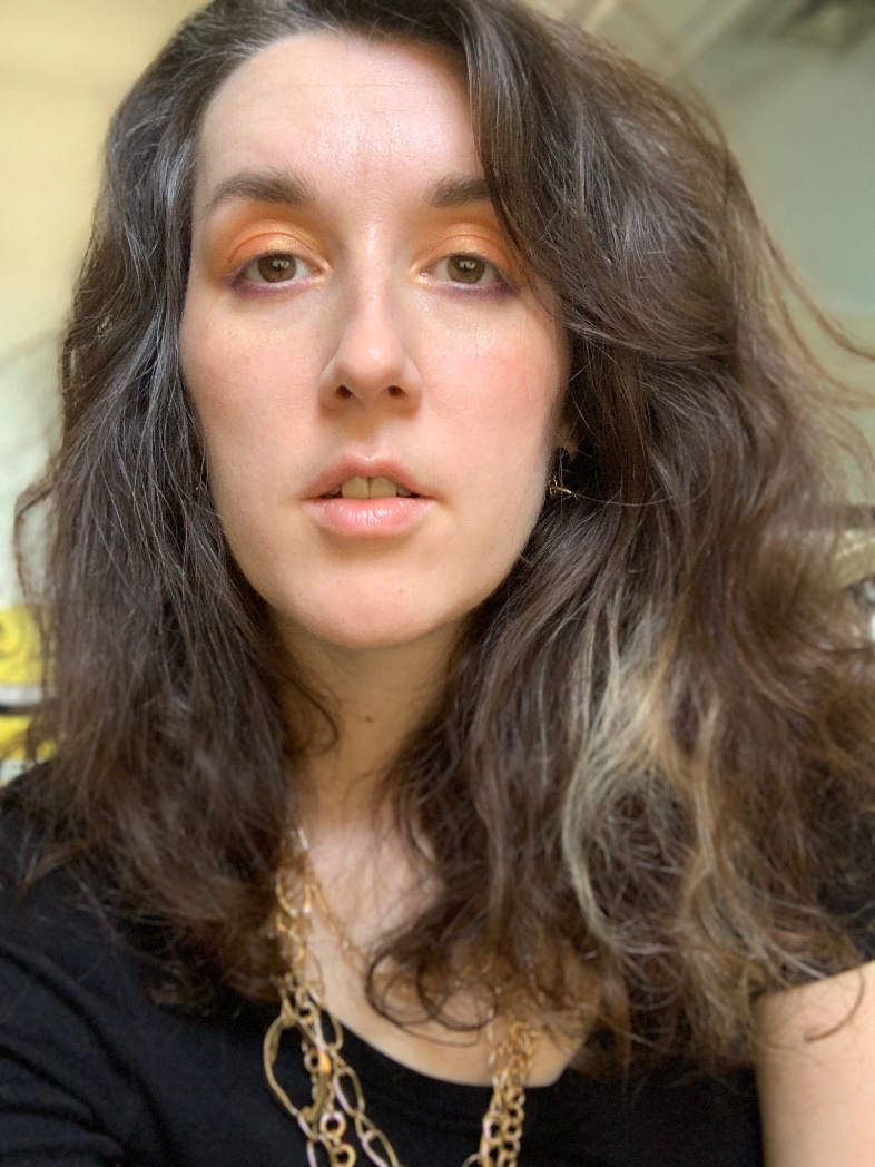 a photo of me with my hair naturally wavy, a bit chaotic looking but presentable
