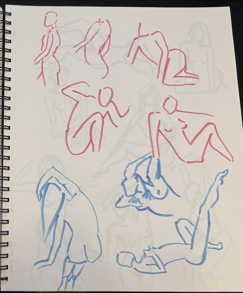 photo of my large sketchbook open to a page of quick figures drawn in red and blue alcohol marker