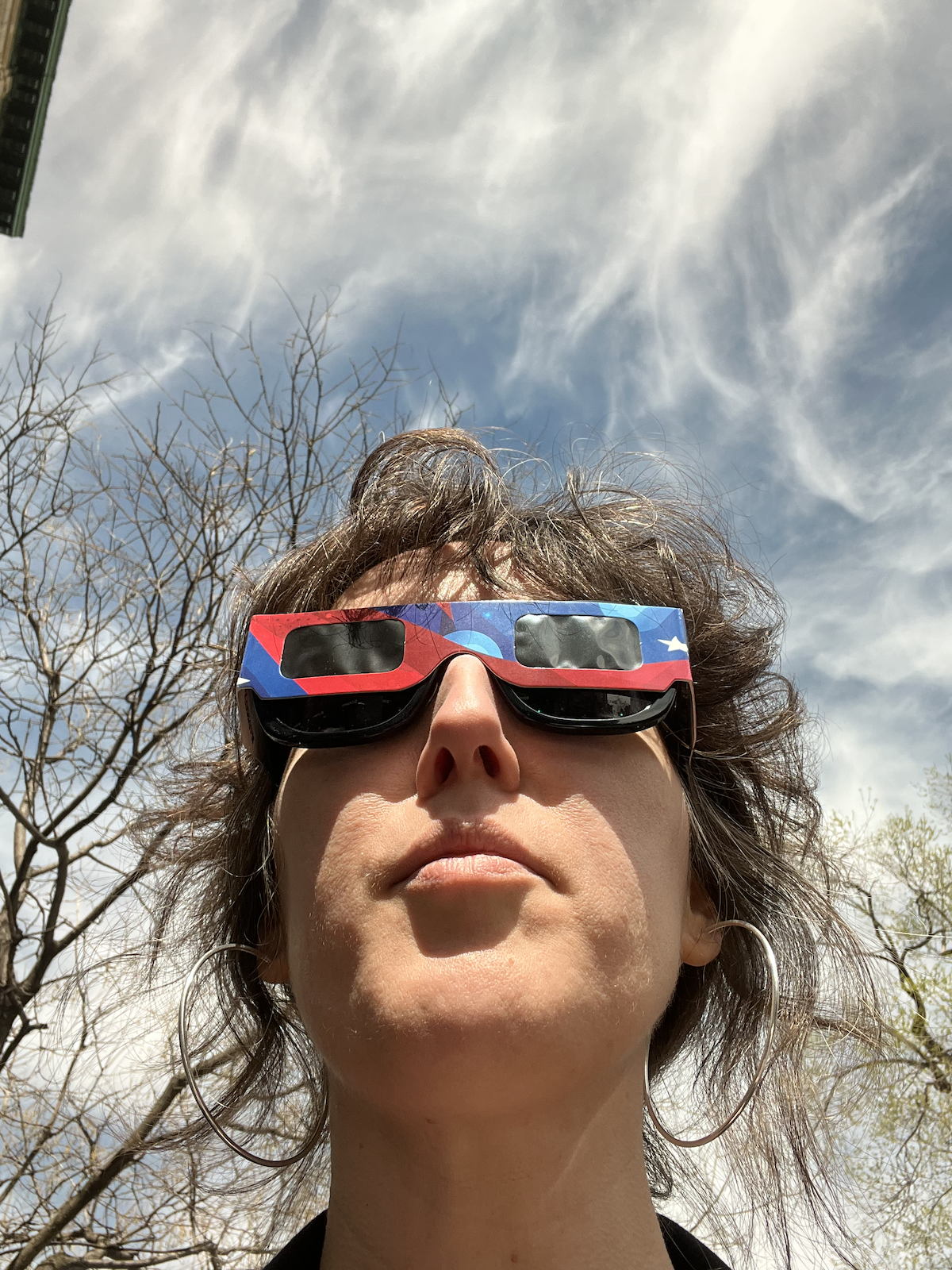 photo of me looking up at the sun and i'm wearing eclipse shades over my regular shades