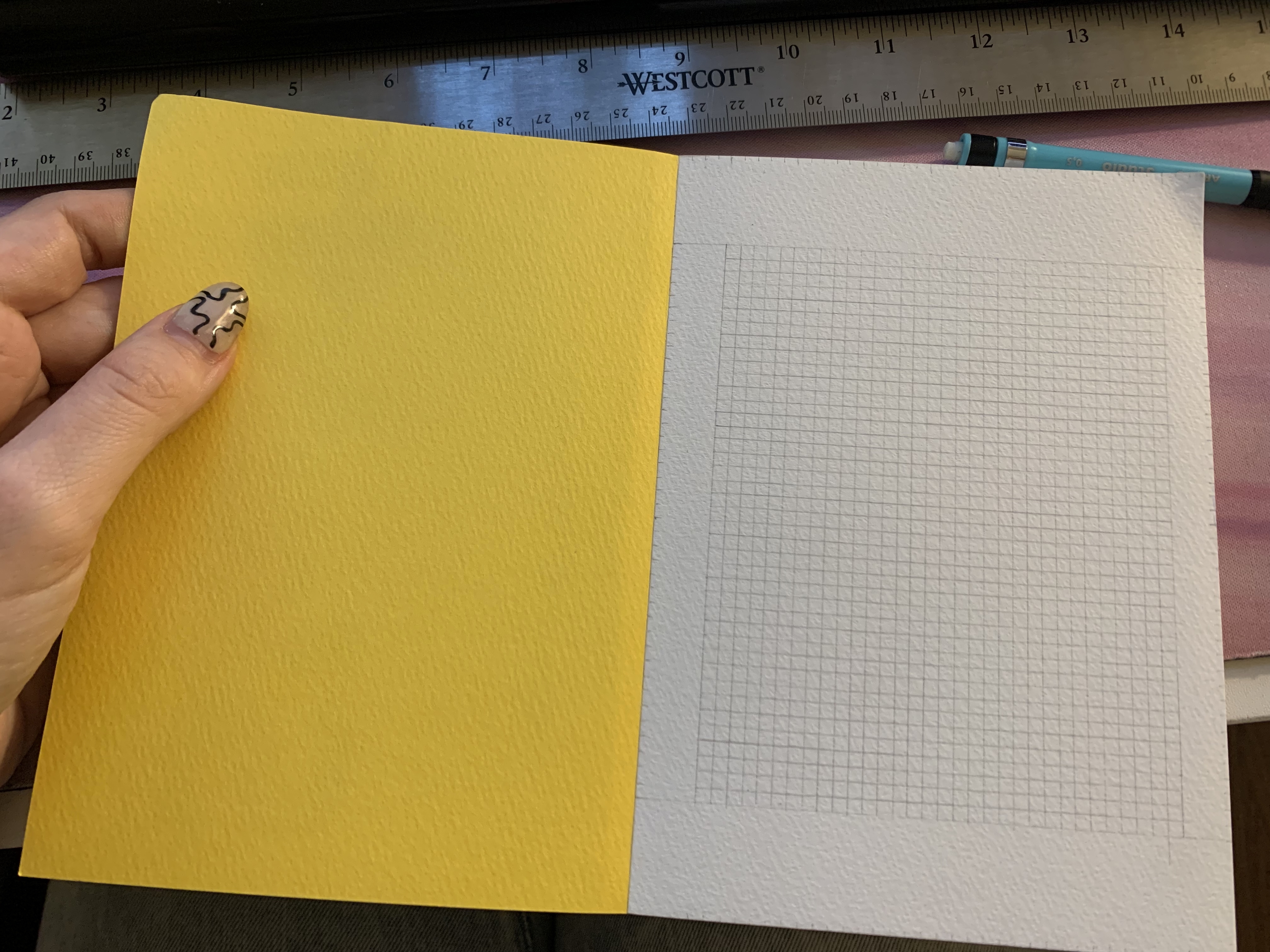 photograph of my sketchpad showing a pencil grid of 40 by 30 squares