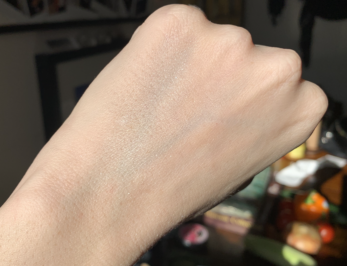 photo of my hand and i'm trying to show off the white shimmer on my hand but it's incredibly faint