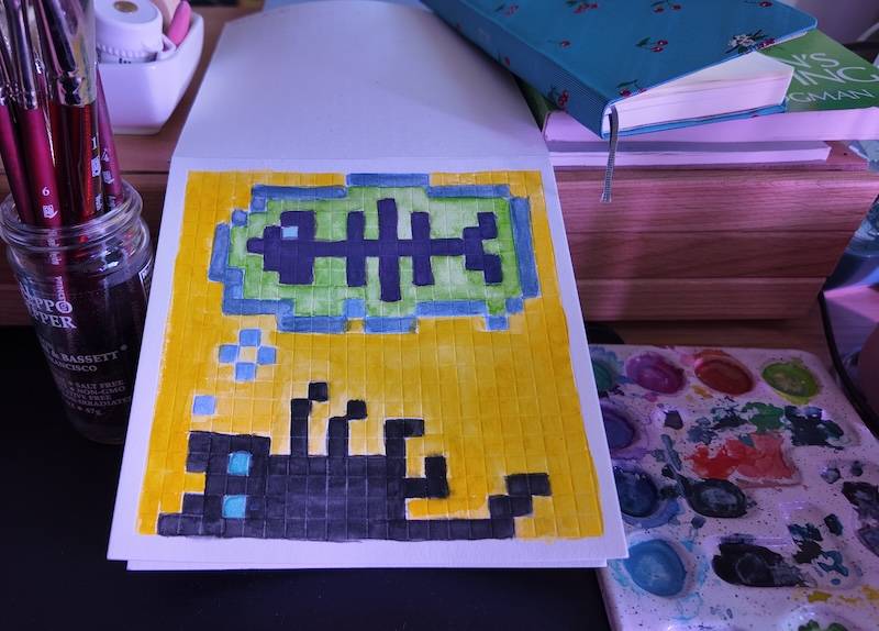 photo of pixel watercolor sketchbook on page 6, a pixel portrait of a black cat dreaming about fish bones