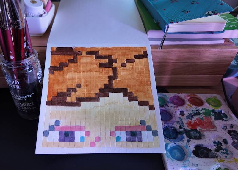 photo of pixel watercolor sketchbook on page 7, a self portrait from my eyes up and i'm about to cry