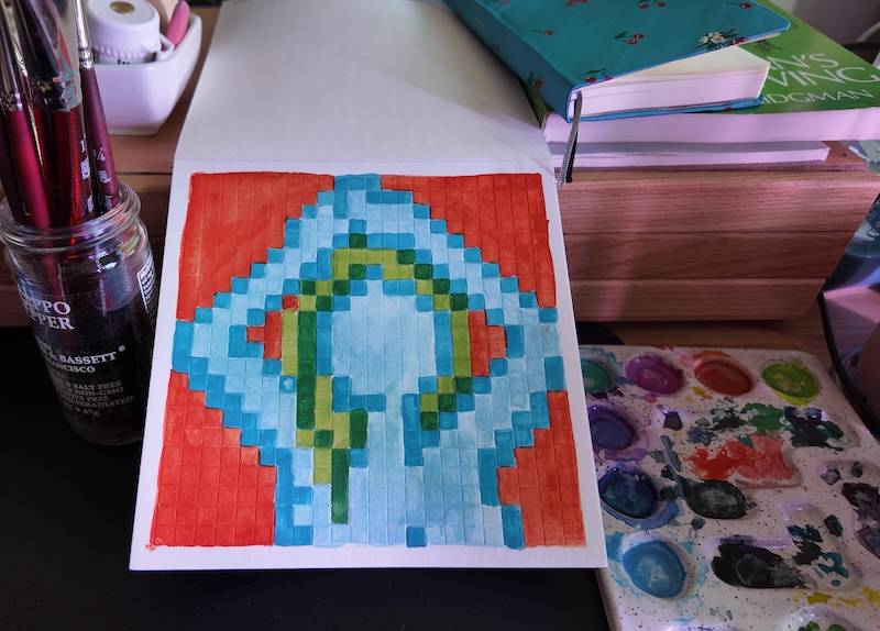 photo of pixel watercolor sketchbook on page 12, a pixel figure drawing of the front view of a woman with blue skin and green hair