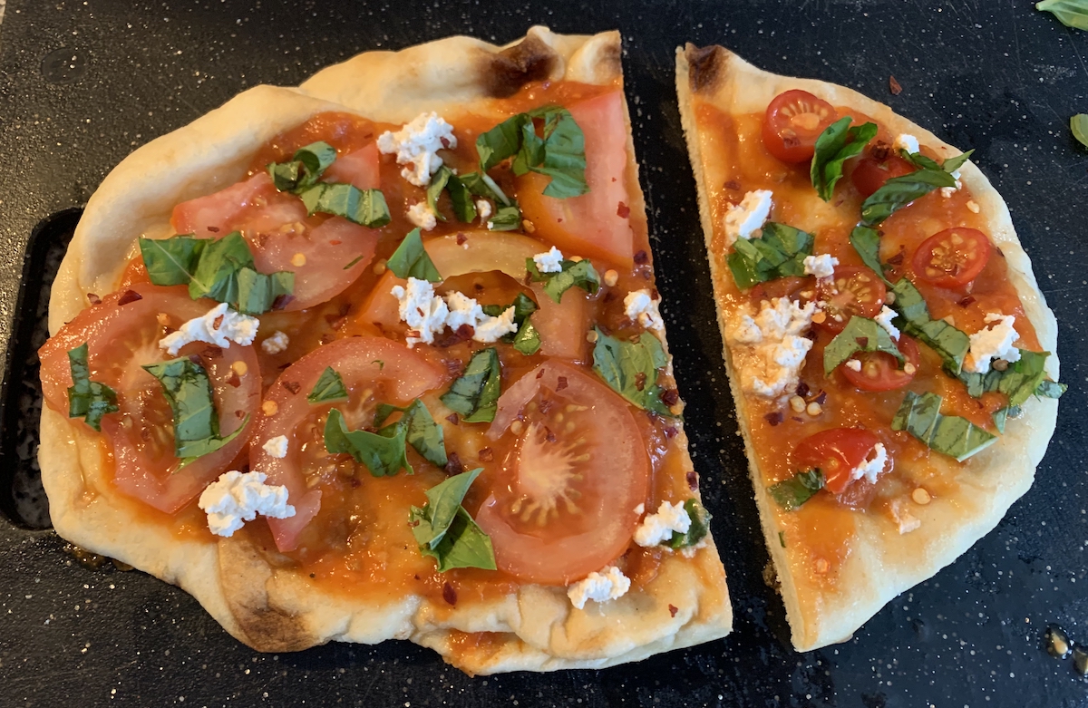 photograph of a tomato flatbread before it's baked