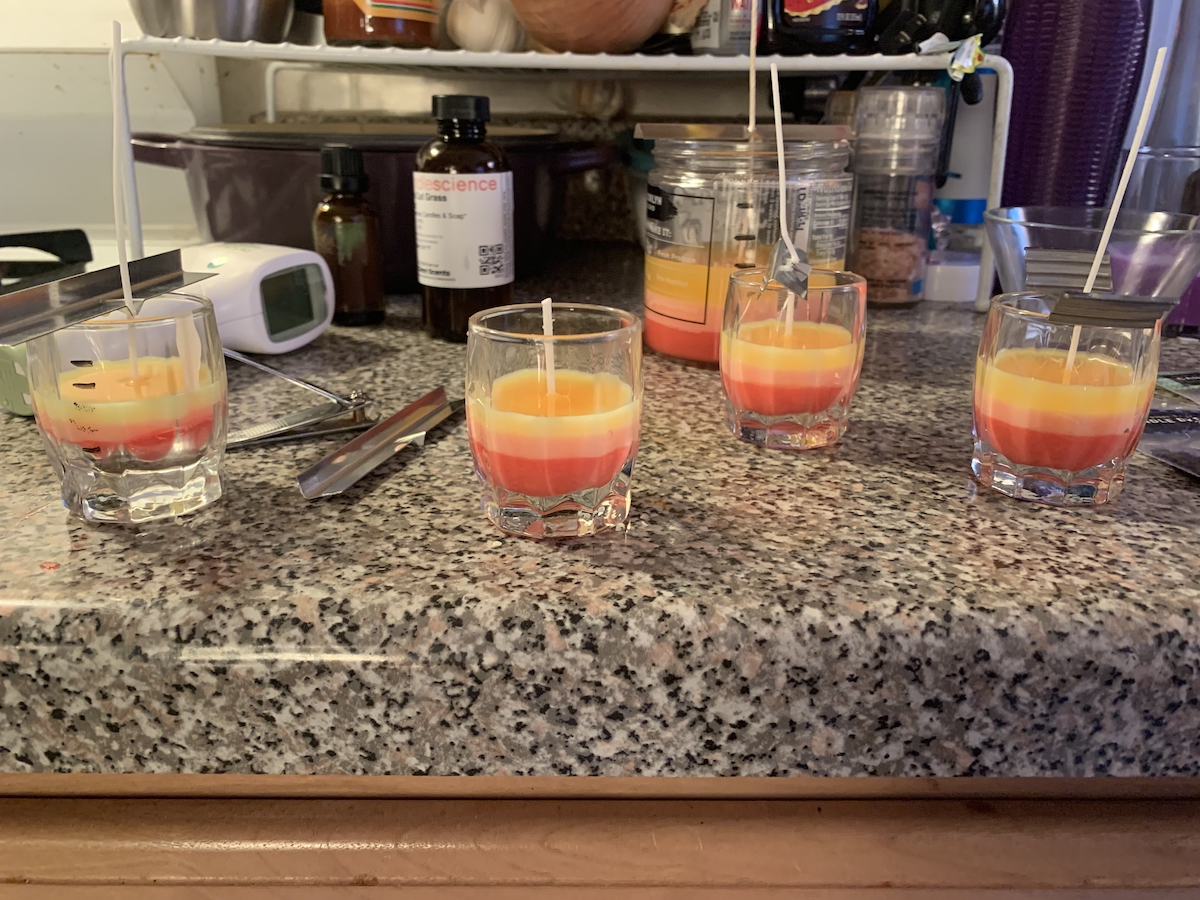 photograph of our little candles with 3 small layers of red, orange and yellow that are pastel